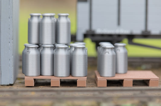 Milk churns on pallets