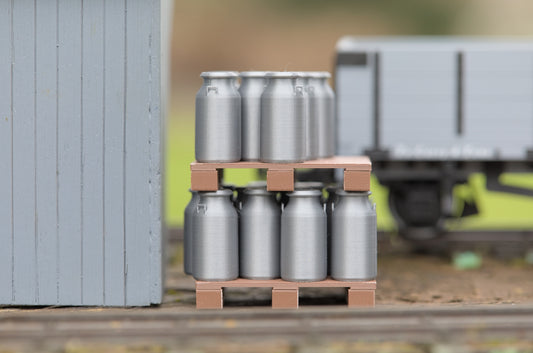 Milk churns on pallets